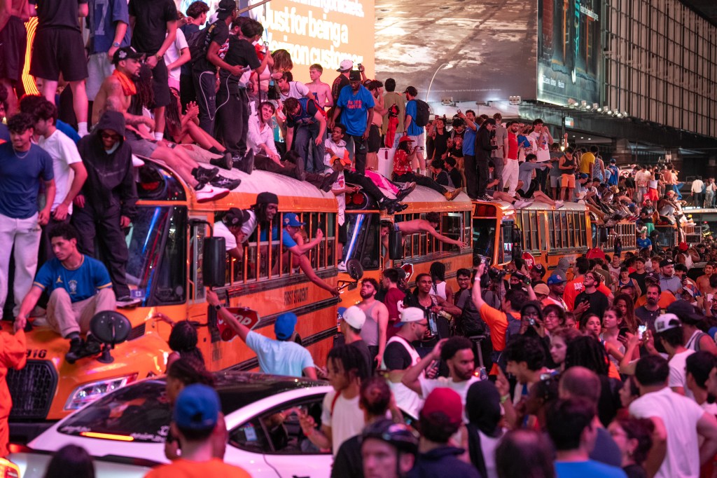 Rampaging Knicks fans tear apart buses, set fires, clash with cops in Times Square, 63 arrests