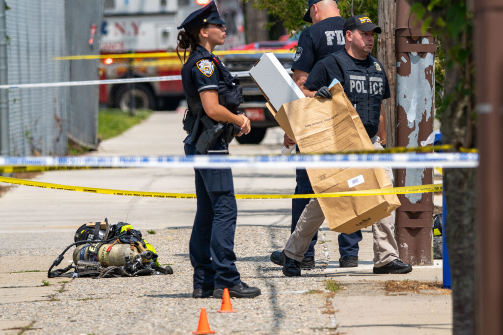 Two relatives found dead as cops shoot gunman after explosion at Queens home